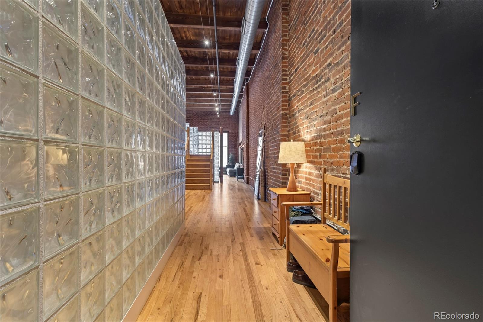 1450 Wynkoop Street, Unit 3F Denver, CO 80202 - Photo 11 of 29 a view of balcony with wooden floor and door