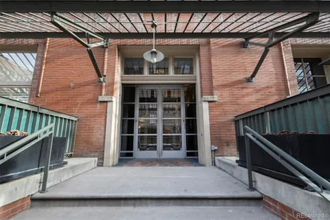 a view of parking garage with cars