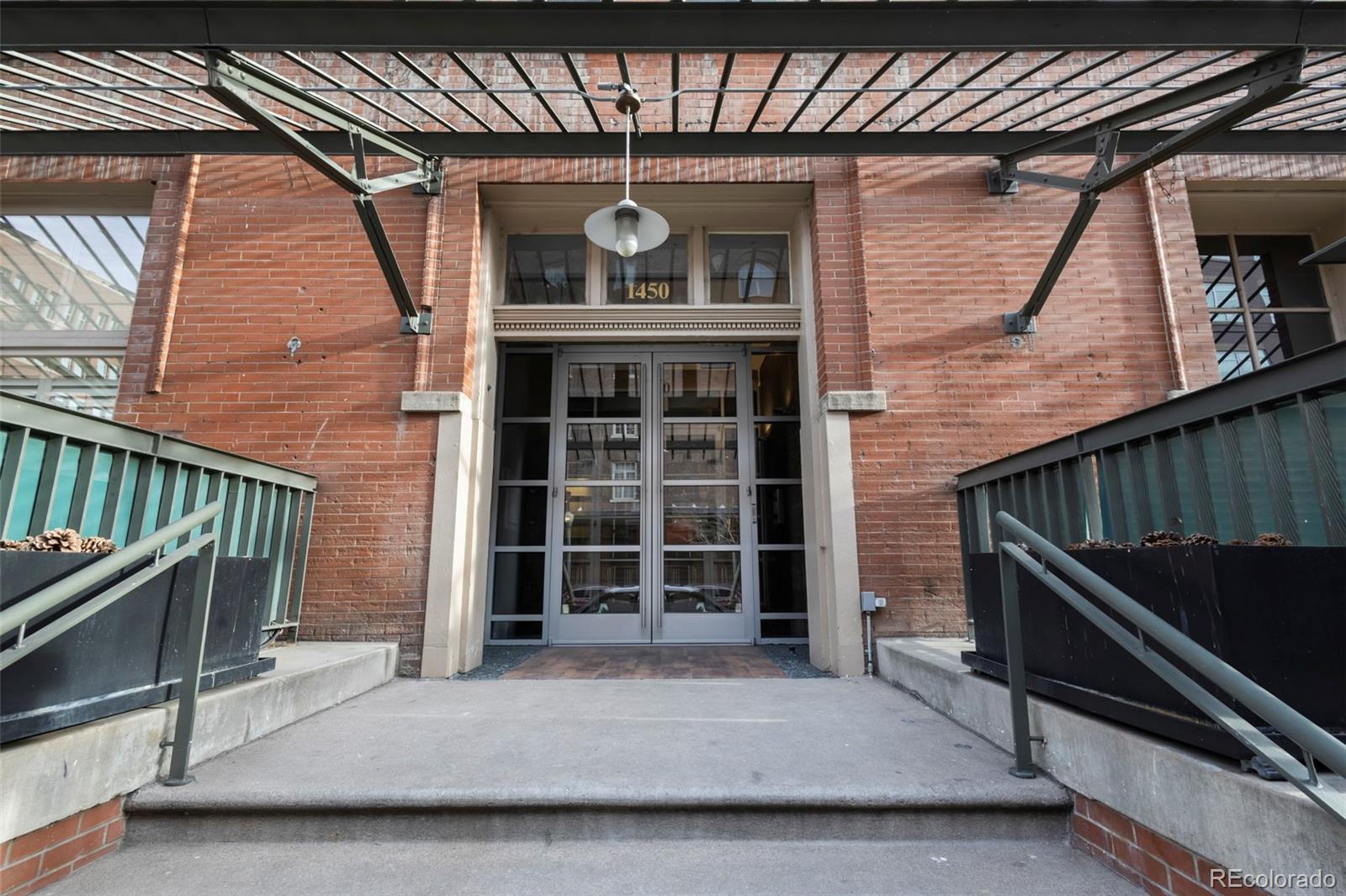 1450 Wynkoop Street, Unit 3F Denver, CO 80202 - Photo 26 of 29 a front view of a house with a porch
