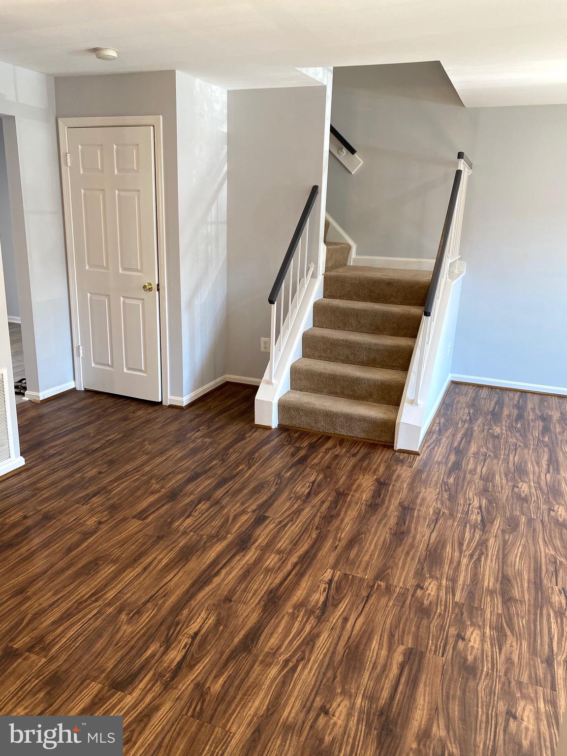 8081 Barcarole Court Springfield, VA 22153 - Photo 14 of 64 a view of entryway with wooden floor