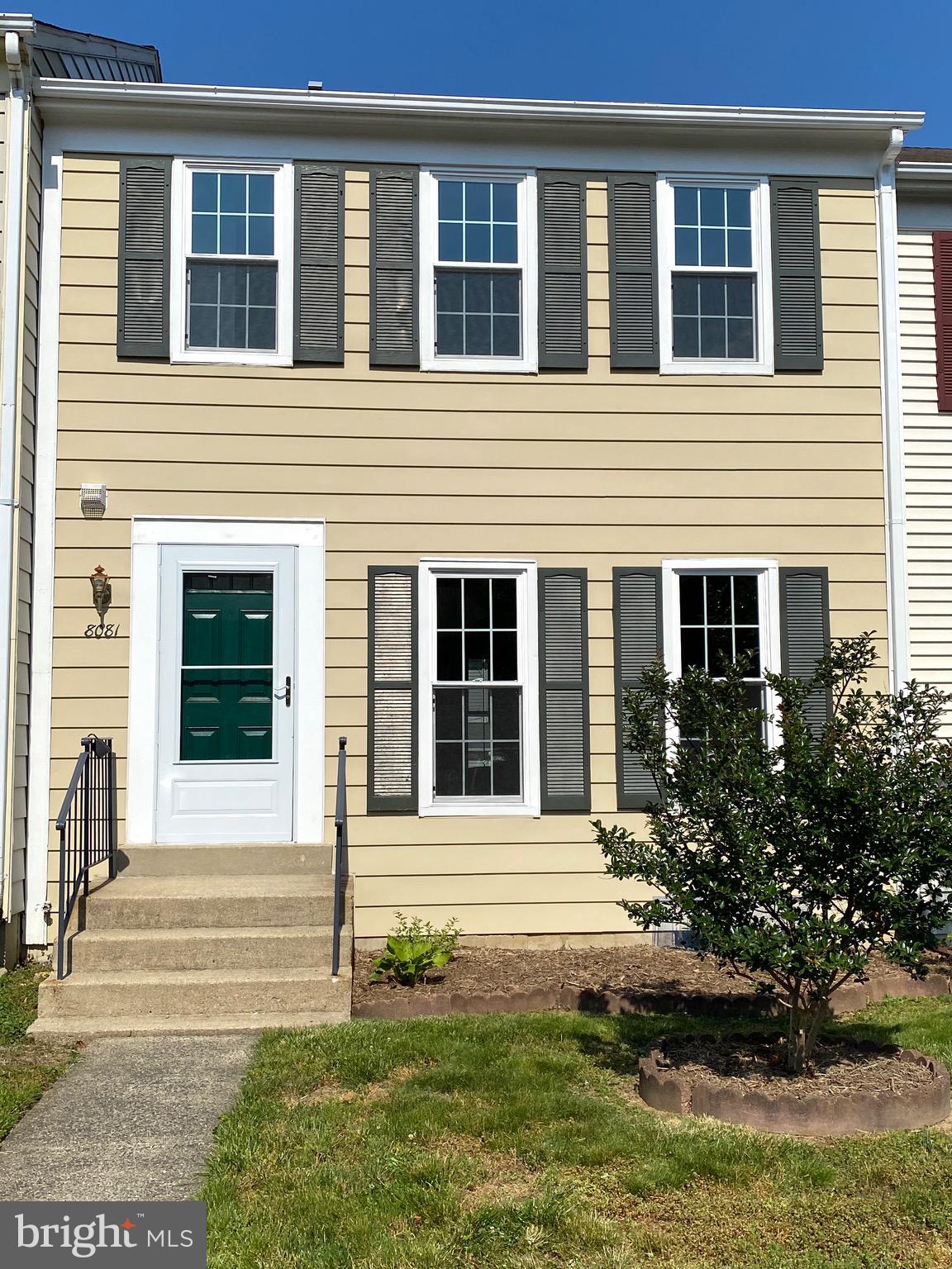 8081 Barcarole Court Springfield, VA 22153 - Photo 2 of 64 a front view of a house with garden