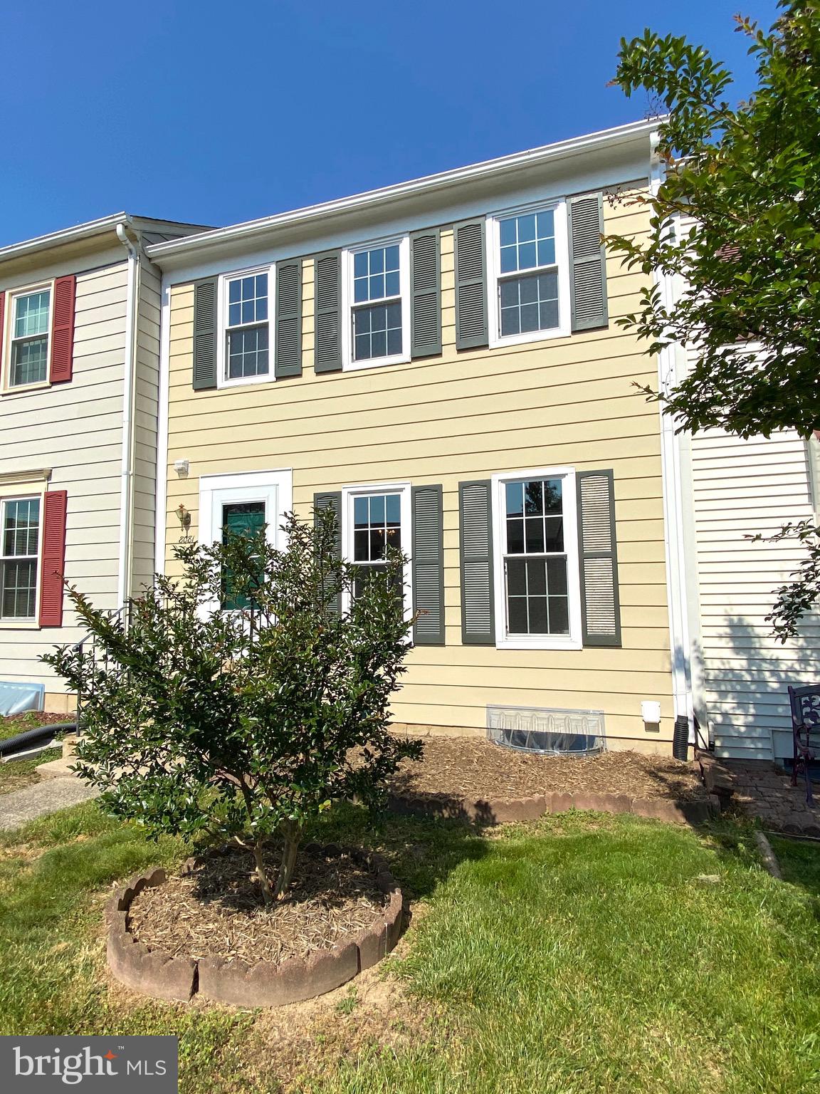 8081 Barcarole Court Springfield, VA 22153 - Photo 3 of 64 a front view of a house with a yard
