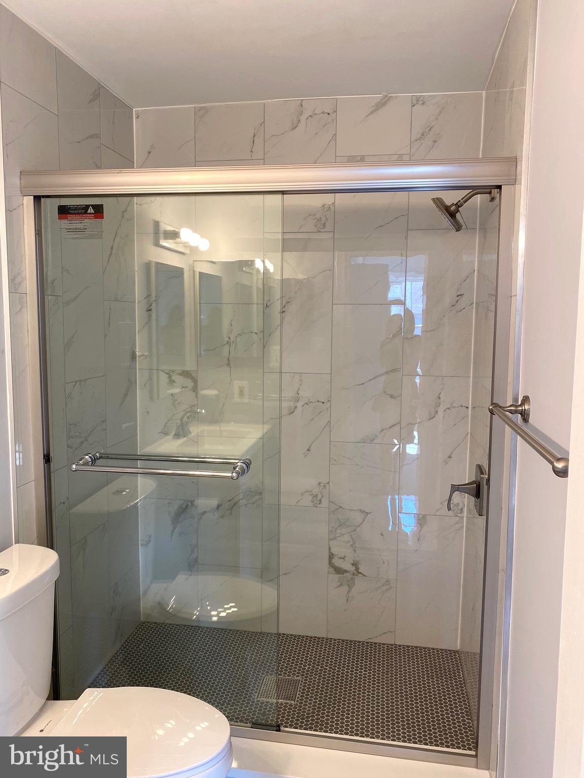 8081 Barcarole Court Springfield, VA 22153 - Photo 32 of 64 a bathroom with a shower and toilet