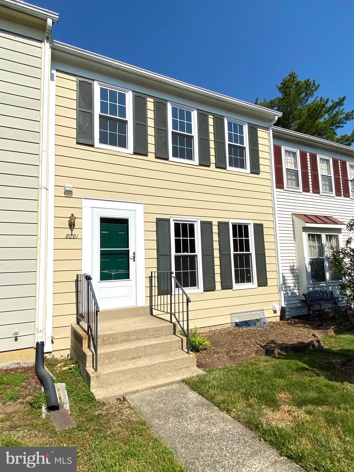 8081 Barcarole Court Springfield, VA 22153 - Photo 4 of 64 a front view of a house with a yard
