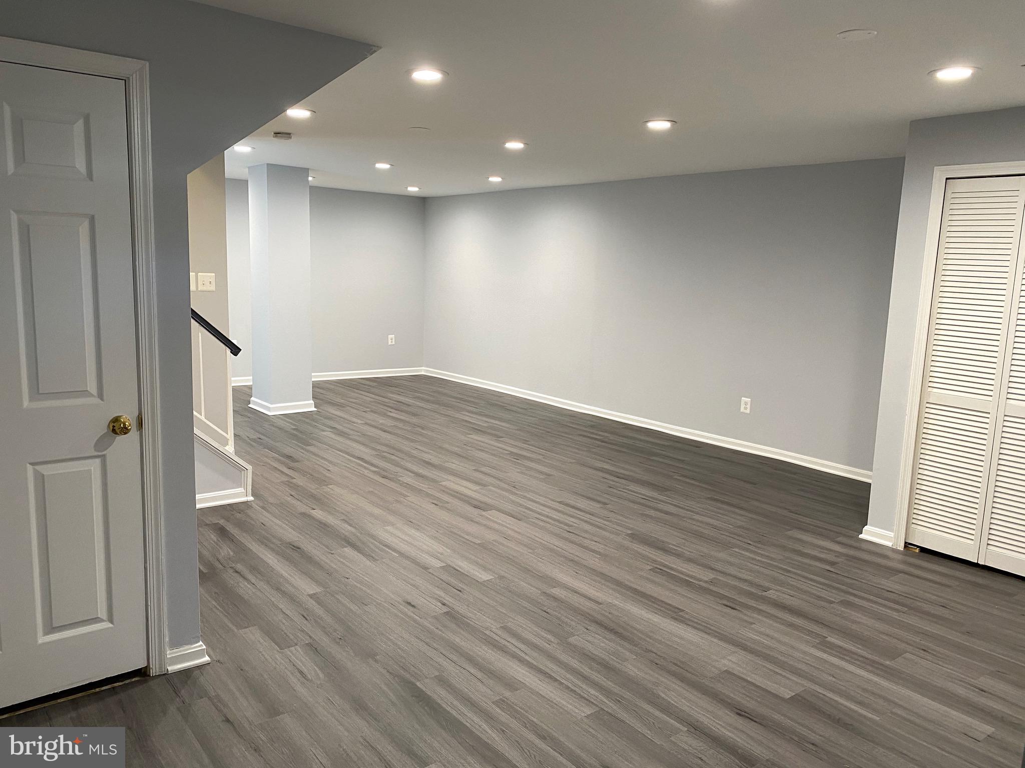 8081 Barcarole Court Springfield, VA 22153 - Photo 46 of 64 an empty room with wooden floor and windows