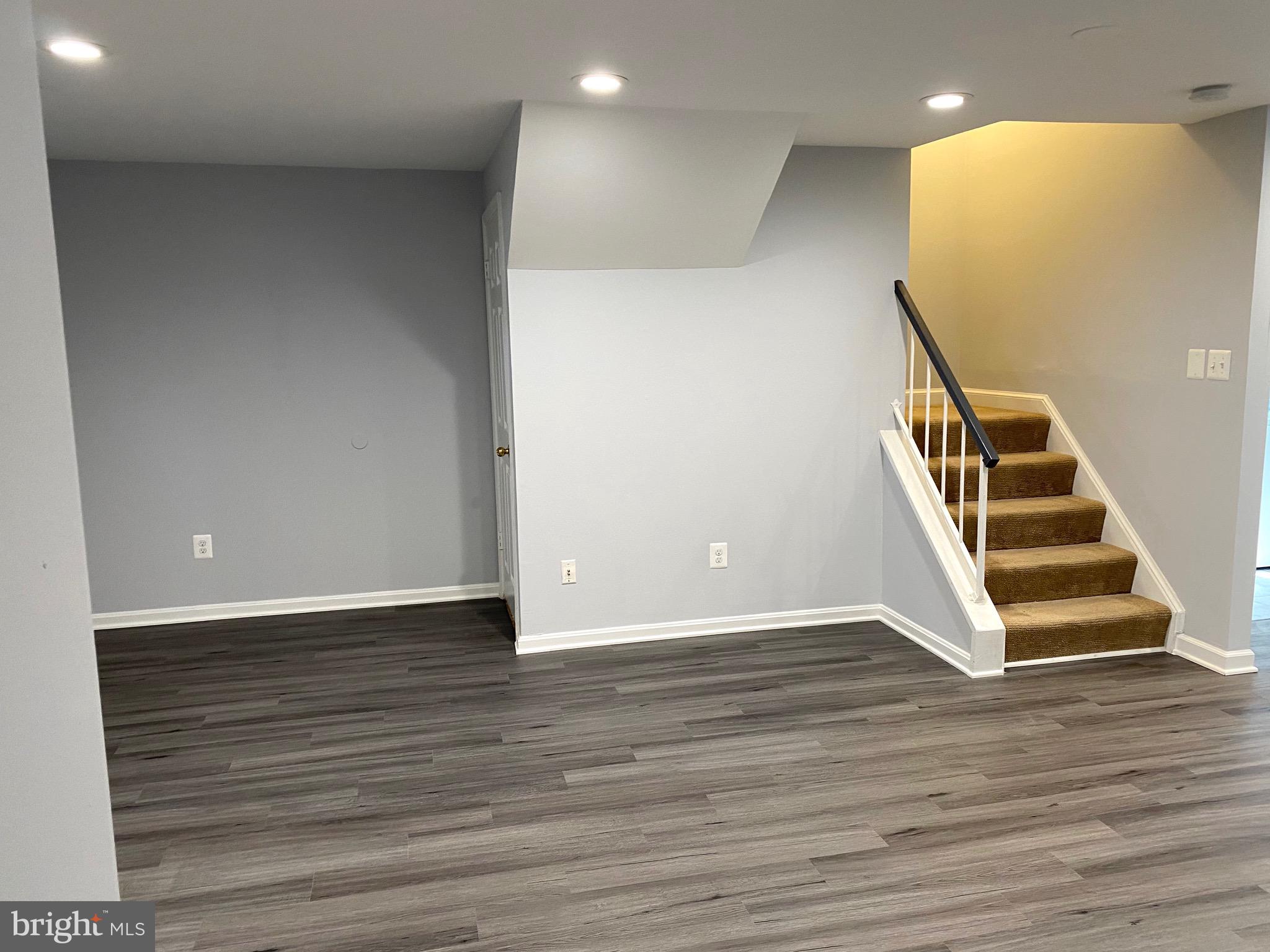 8081 Barcarole Court Springfield, VA 22153 - Photo 50 of 64 a view of an entryway with wooden floor