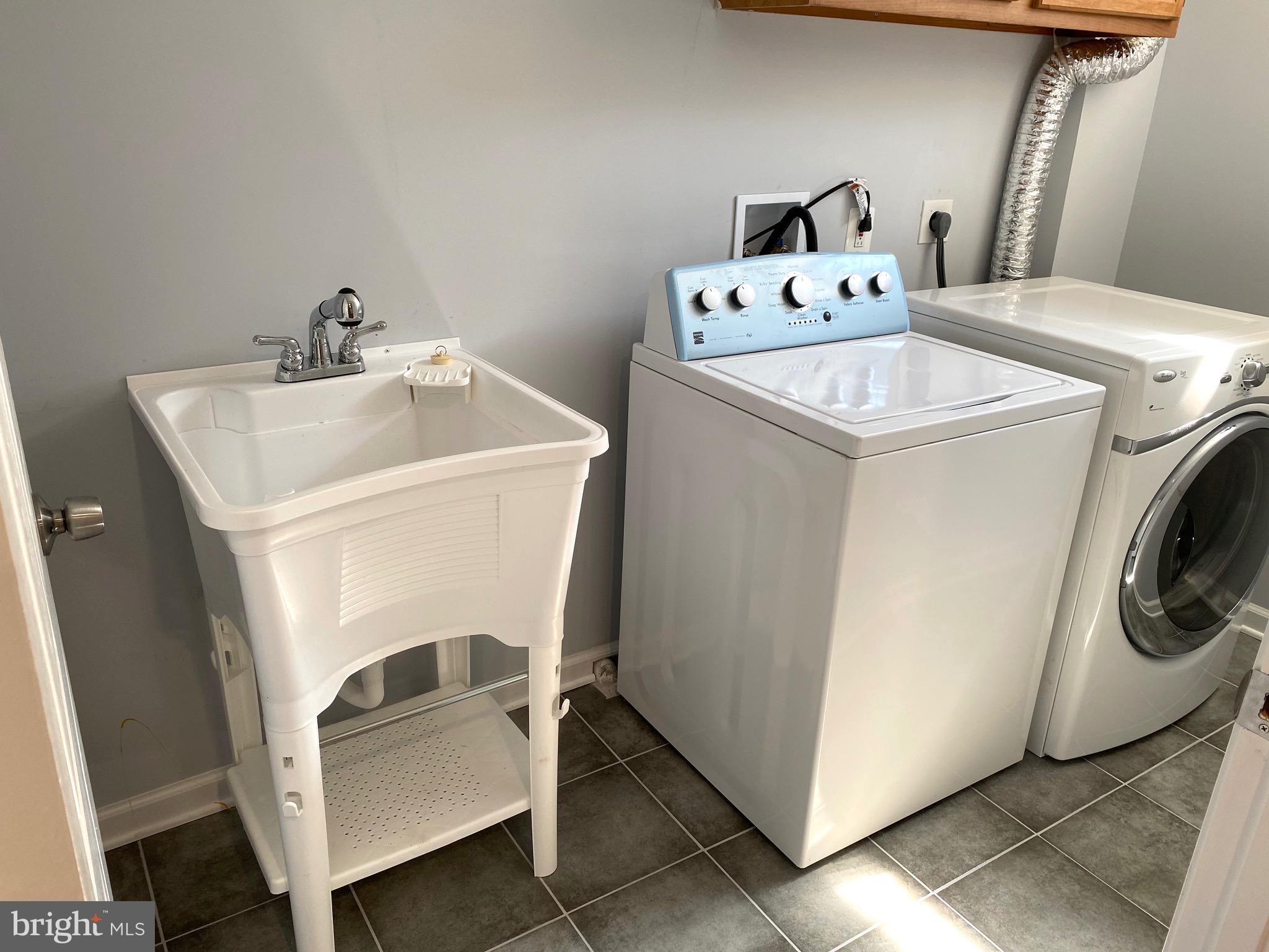 8081 Barcarole Court Springfield, VA 22153 - Photo 53 of 64 a utility room with dryer and washer