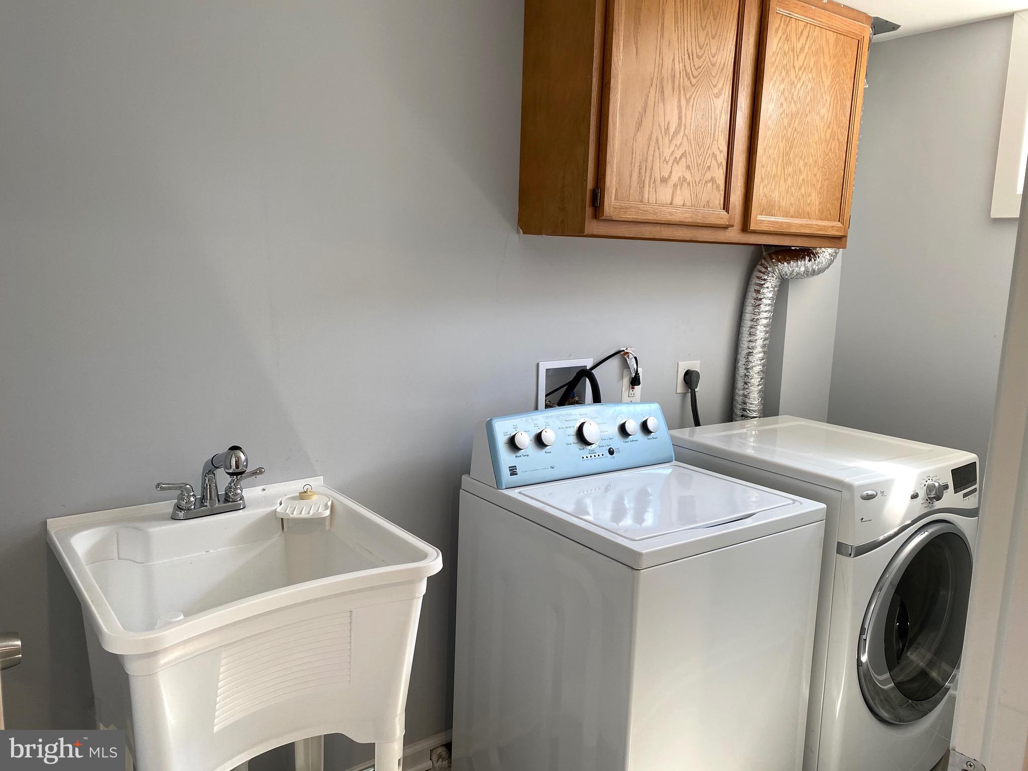 8081 Barcarole Court Springfield, VA 22153 - Photo 54 of 64 a utility room with dryer and washer