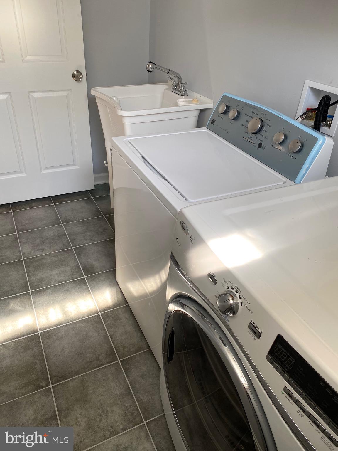 8081 Barcarole Court Springfield, VA 22153 - Photo 55 of 64 a utility room with dryer and washer