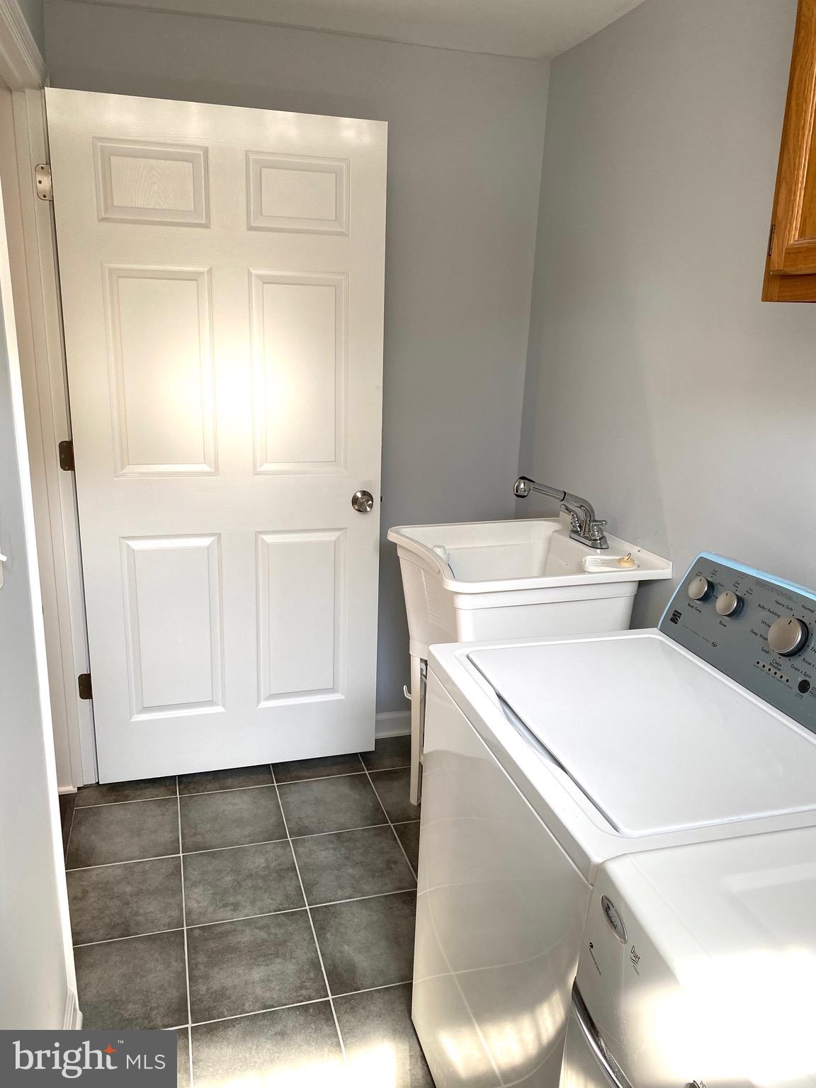 8081 Barcarole Court Springfield, VA 22153 - Photo 56 of 64 a utility room with dryer and washer