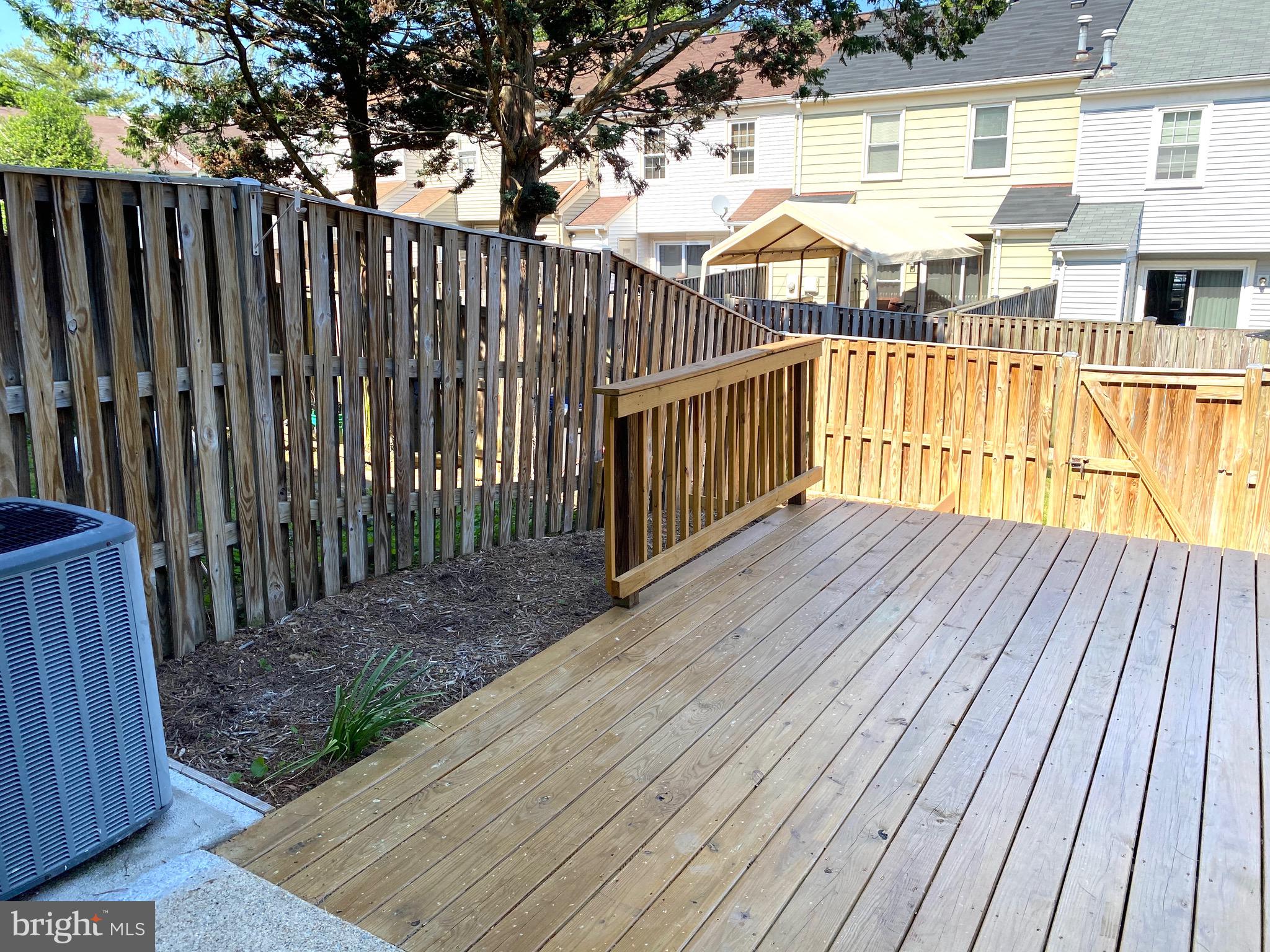 8081 Barcarole Court Springfield, VA 22153 - Photo 58 of 64 a view of a wooden balcony with wooden floor