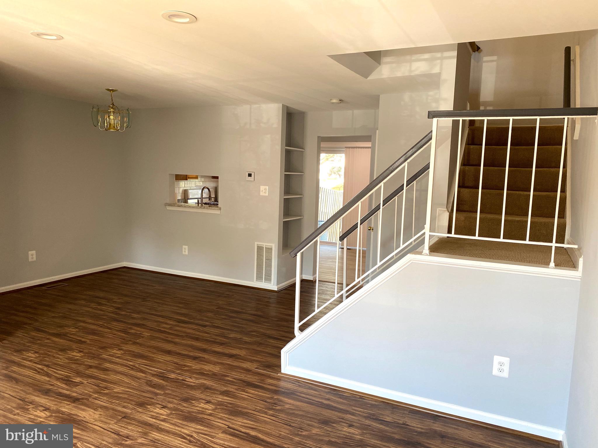 8081 Barcarole Court Springfield, VA 22153 - Photo 9 of 64 a view of an entryway with wooden floor