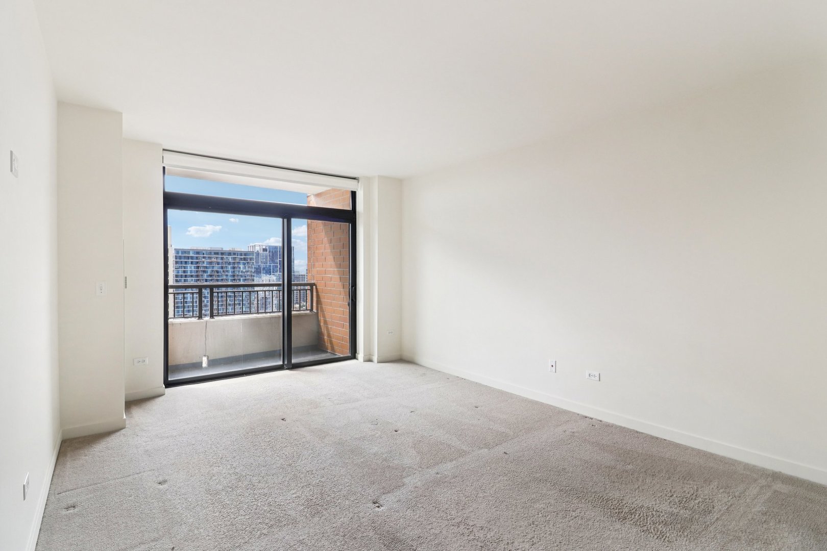 1160 South Michigan Avenue, Unit 2502 Chicago, IL 60605 - Photo 17 of 44 a view of an empty room with a window