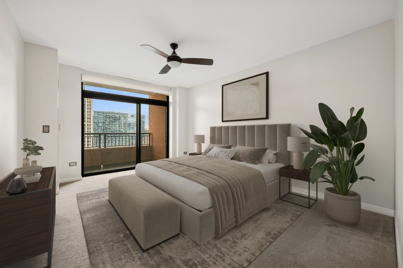 1160 South Michigan Avenue, Unit 2502 Chicago, IL 60605 - Photo 19 of 44 a bedroom with a large bed and a potted plant