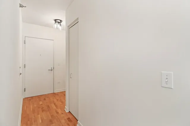 a view of hallway with closet