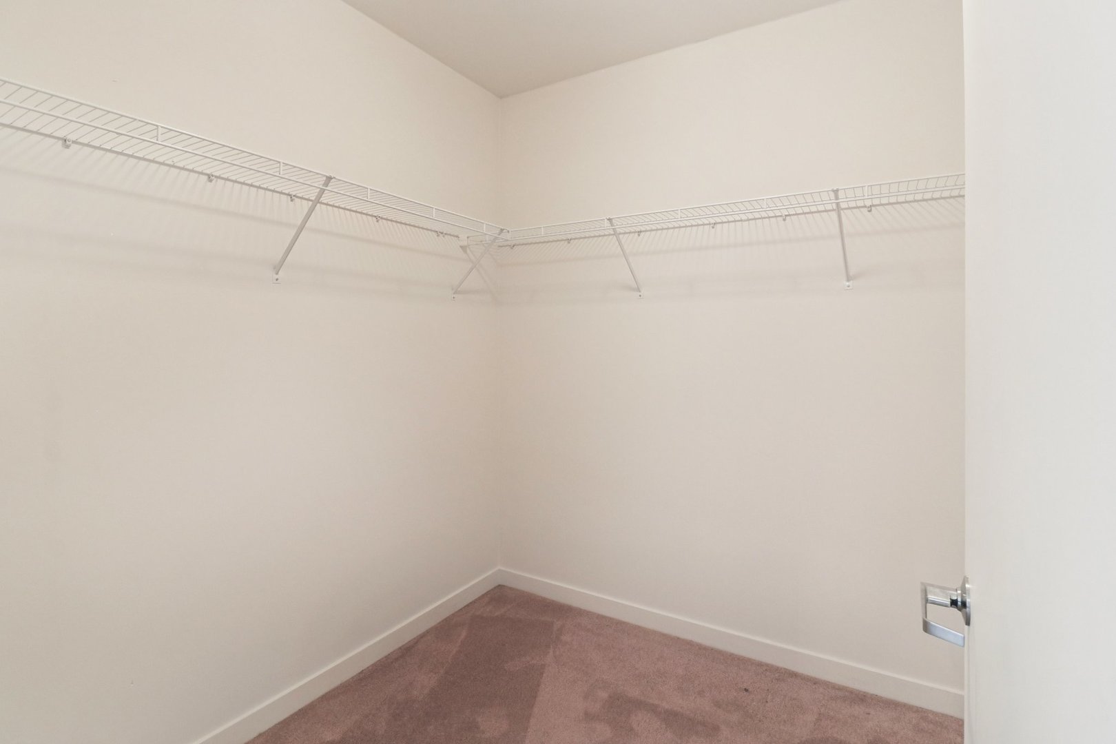 1160 South Michigan Avenue, Unit 2502 Chicago, IL 60605 - Photo 32 of 44 a view of a room with racks on the wall