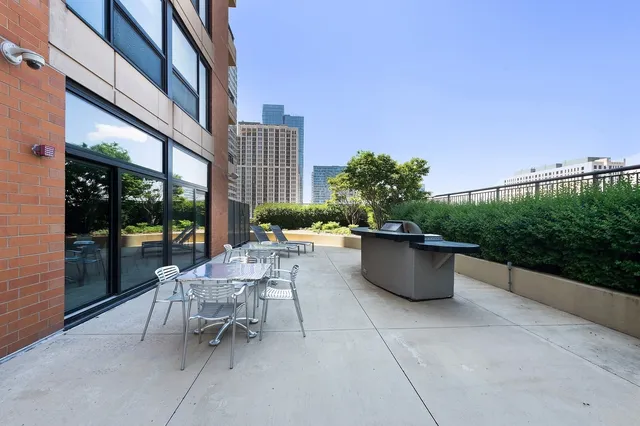 a terrace with outdoor seating and plants