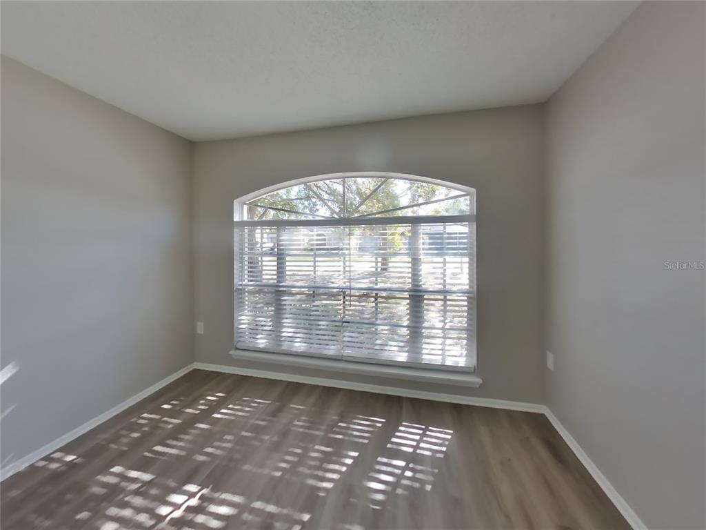 Undisclosed Address Brandon, FL 33511 - Photo 11 of 18 an empty room with a empty space and windows
