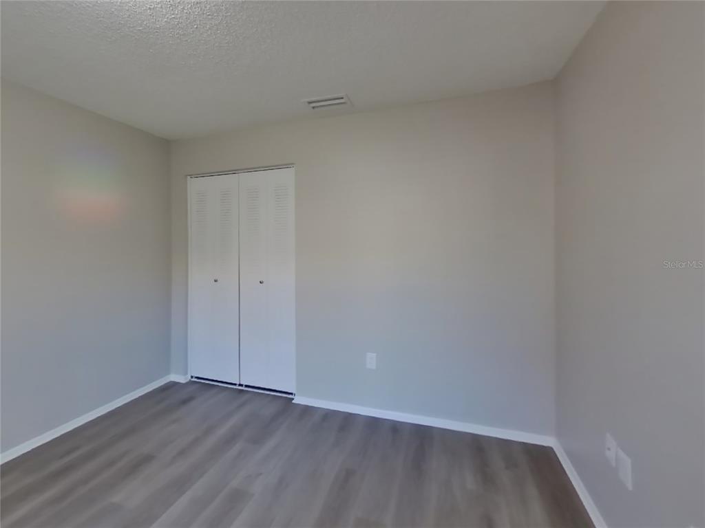 Undisclosed Address Brandon, FL 33511 - Photo 14 of 18 a view of an empty room and wooden floor