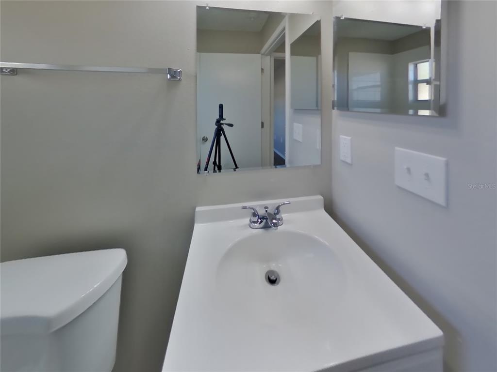 Undisclosed Address Brandon, FL 33511 - Photo 16 of 18 a bathroom with a sink and a toilet