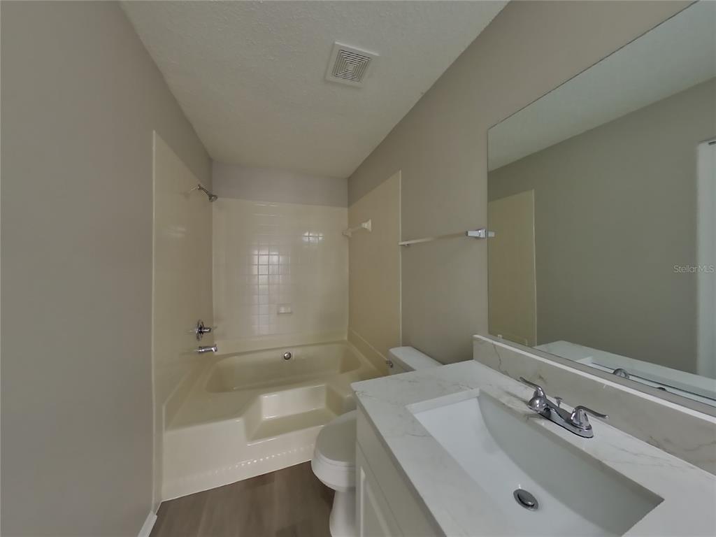 Undisclosed Address Brandon, FL 33511 - Photo 9 of 18 a bathroom with a sink a toilet and shower