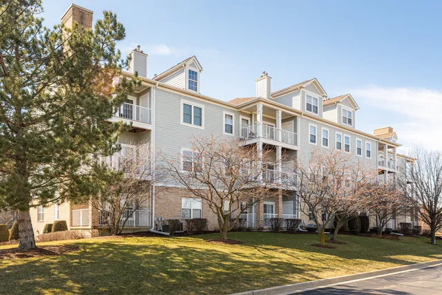 a view of a building with a yard