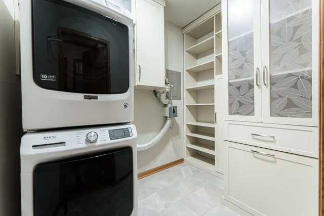 a utility room with washer and dryer