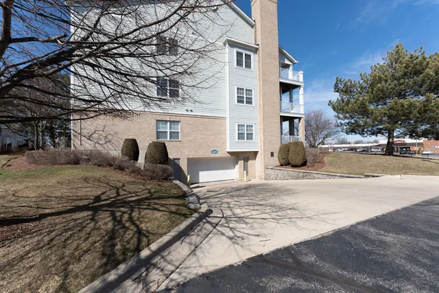 a view of a house with snow on the road
