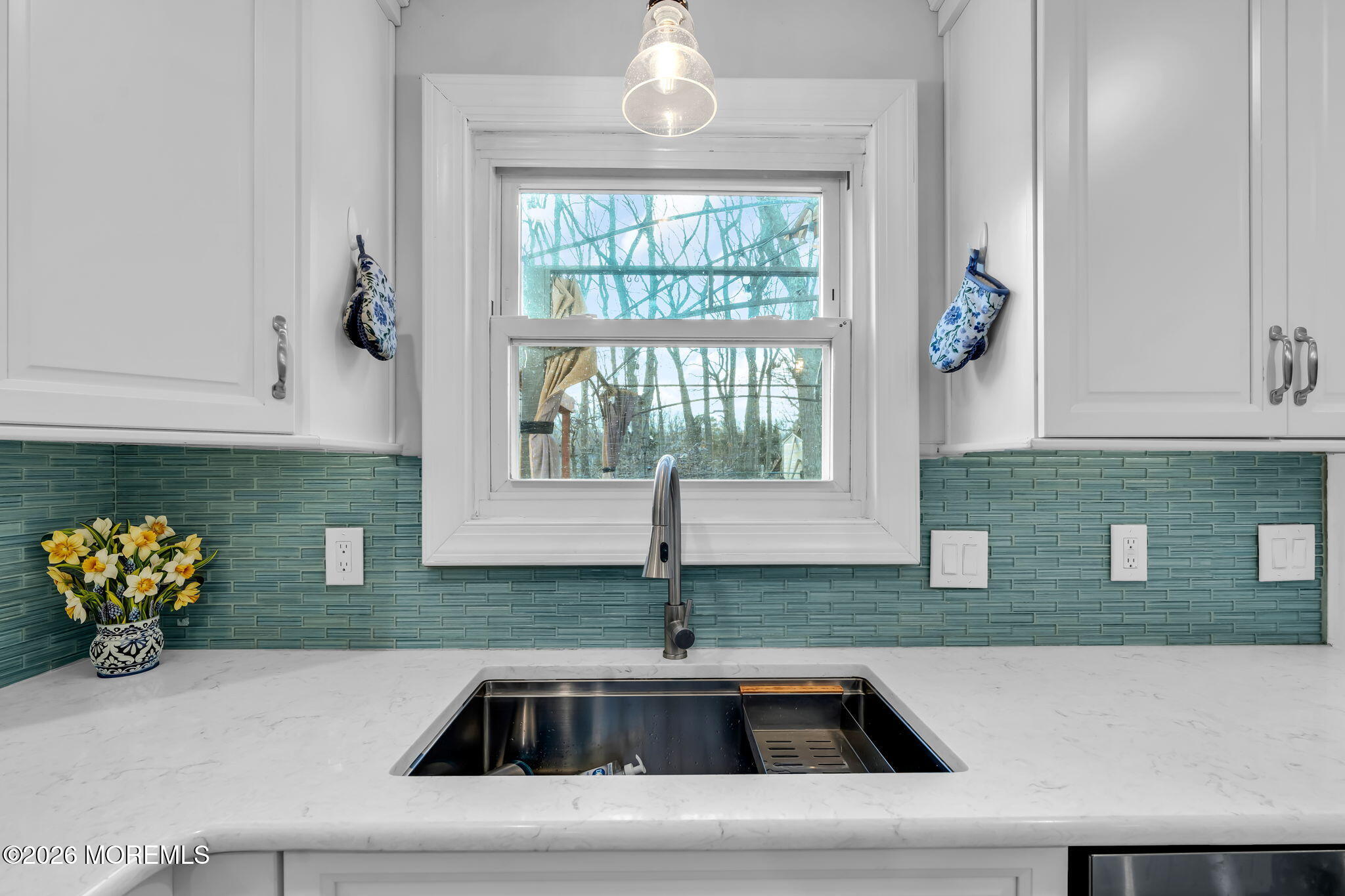 a kitchen with a sink and a window