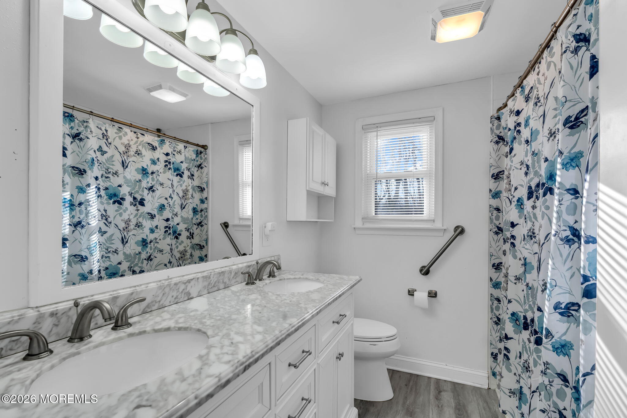 13 Dunbarton Road Jackson, NJ 08527 - Photo 11 of 34 a bathroom with a granite countertop sink a toilet and a mirror