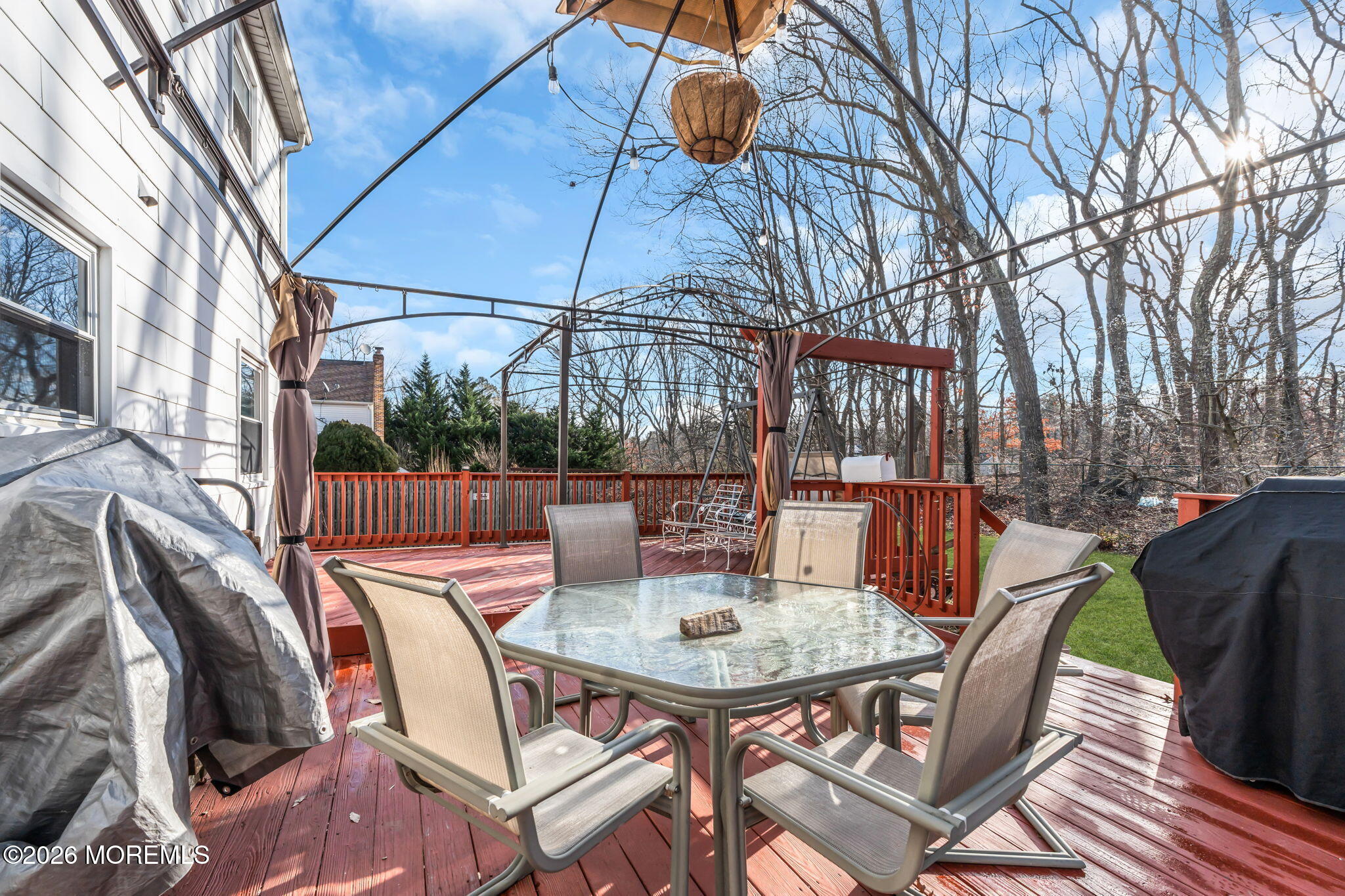 13 Dunbarton Road Jackson, NJ 08527 - Photo 16 of 34 a view of a patio with a table chairs and backyard