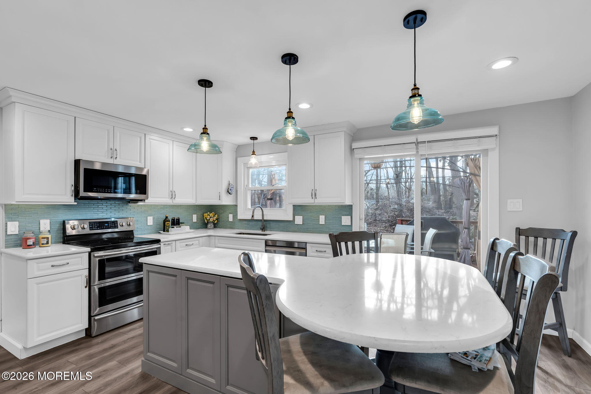 13 Dunbarton Road Jackson, NJ 08527 - Photo 2 of 34 a kitchen with stainless steel appliances granite countertop a sink a stove a kitchen island a dining table and chairs