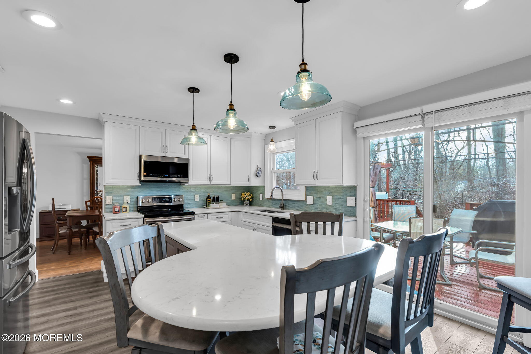 13 Dunbarton Road Jackson, NJ 08527 - Photo 28 of 34 a kitchen with stainless steel appliances granite countertop a kitchen island a stove a table and chairs