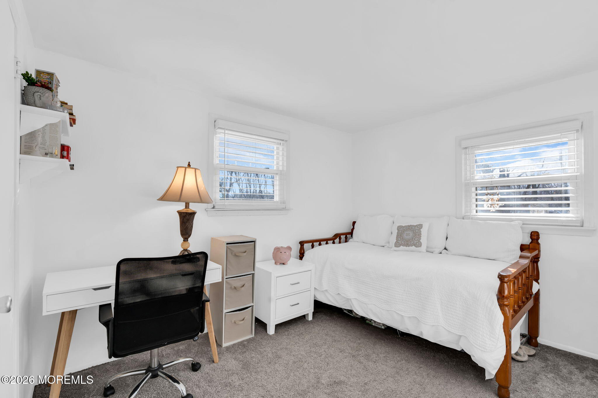 13 Dunbarton Road Jackson, NJ 08527 - Photo 9 of 34 a bedroom with a bed and a chandelier