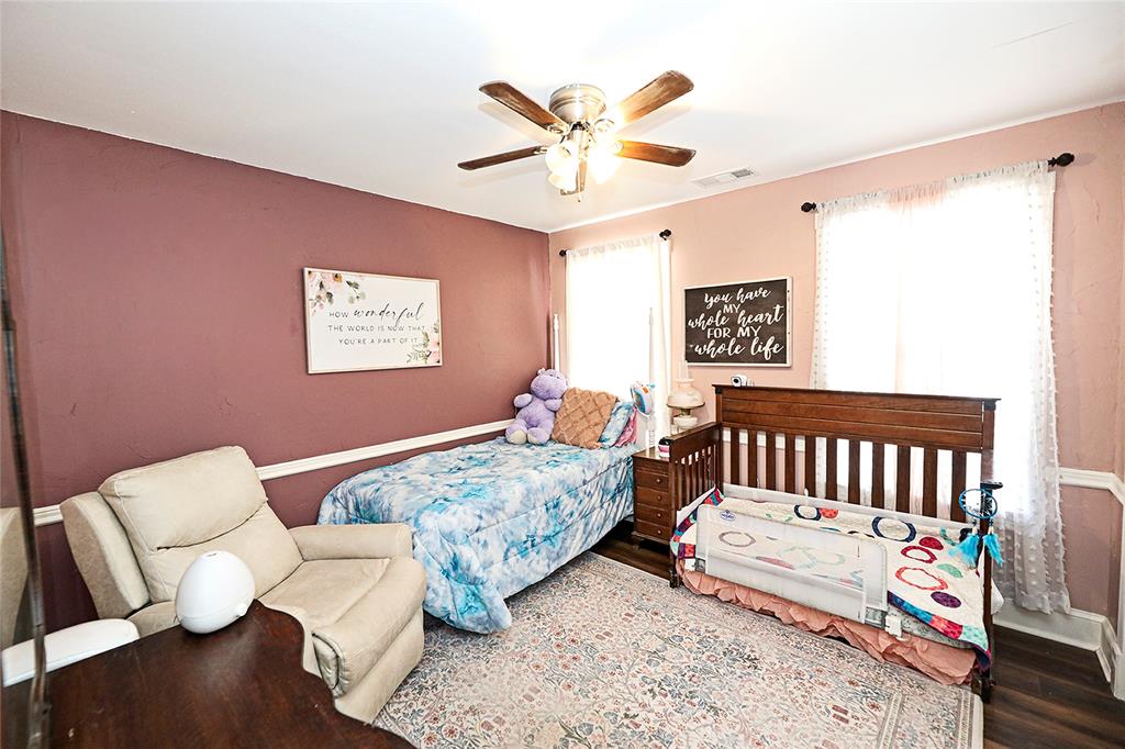 1364 Winn Road Bowie, TX 76230 - Photo 21 of 38 a bedroom with furniture and a large window