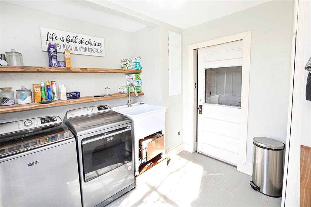 1364 Winn Road Bowie, TX 76230 - Photo 24 of 38 a kitchen with a stove and cabinets