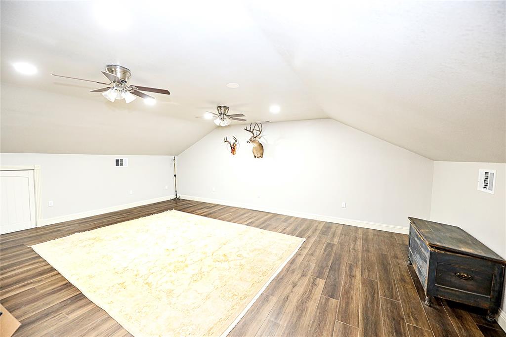 1364 Winn Road Bowie, TX 76230 - Photo 26 of 38 a view of a room with wooden floor