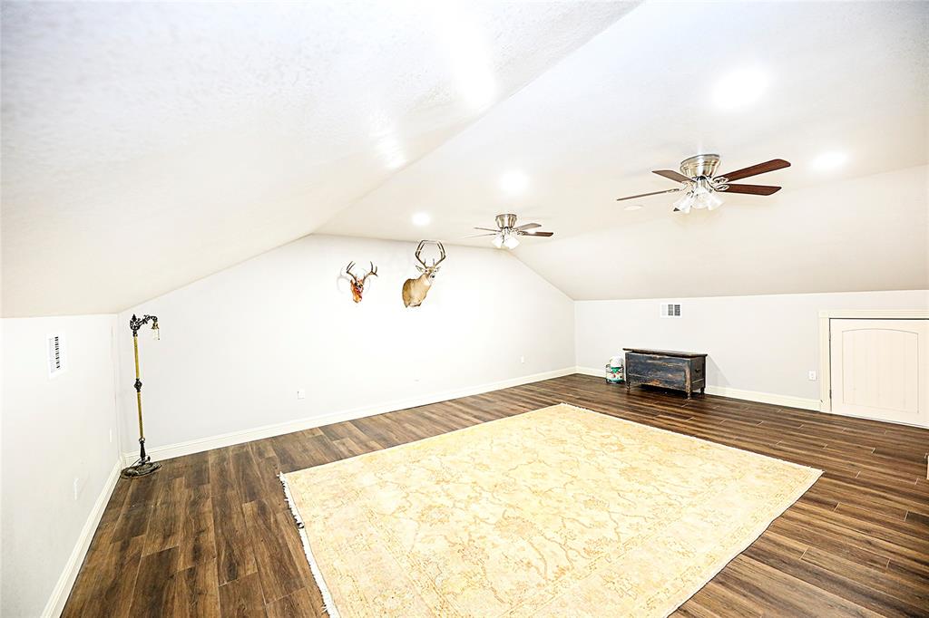 1364 Winn Road Bowie, TX 76230 - Photo 27 of 38 a view of a room with wooden floor