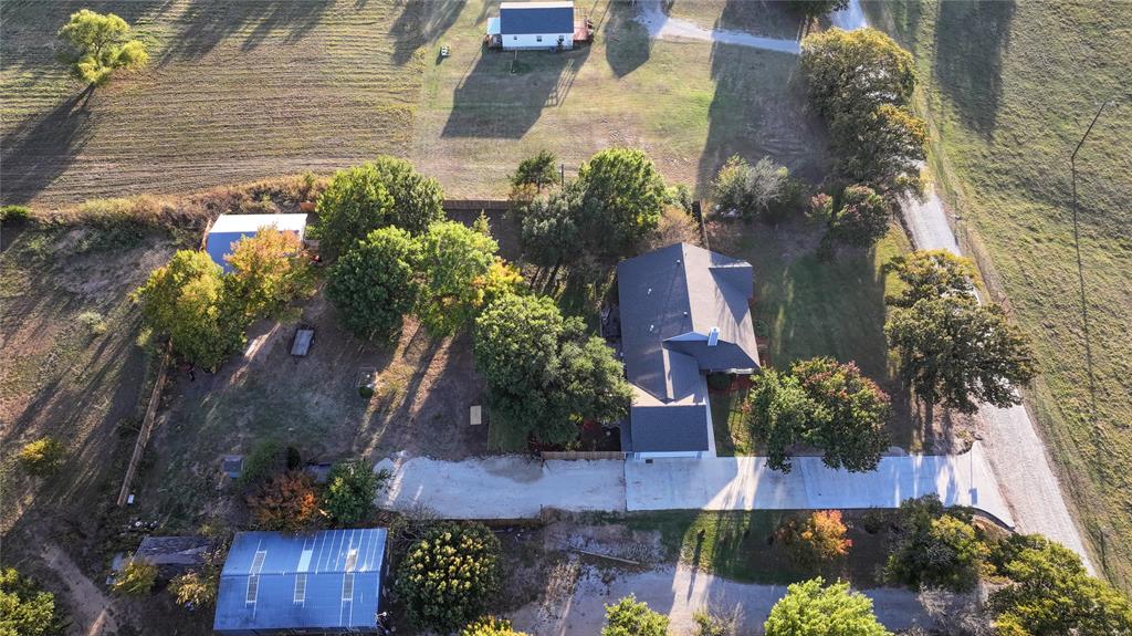 1364 Winn Road Bowie, TX 76230 - Photo 34 of 38 an aerial view of a house with a yard and garden