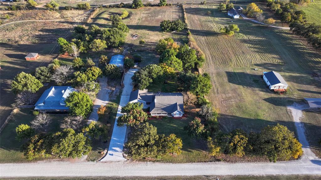 1364 Winn Road Bowie, TX 76230 - Photo 36 of 38 an aerial view of a house with a yard