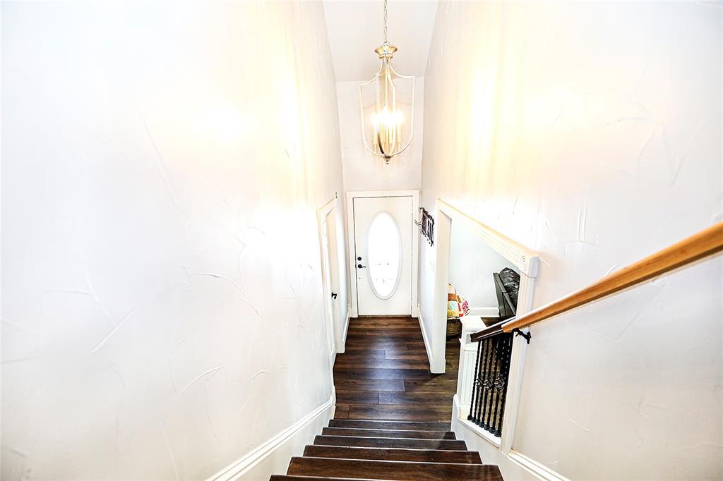 1364 Winn Road Bowie, TX 76230 - Photo 6 of 38 a view of entryway and hall with wooden floor