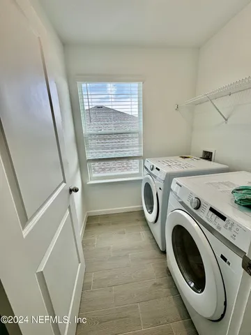 a utility room with dryer and washer
