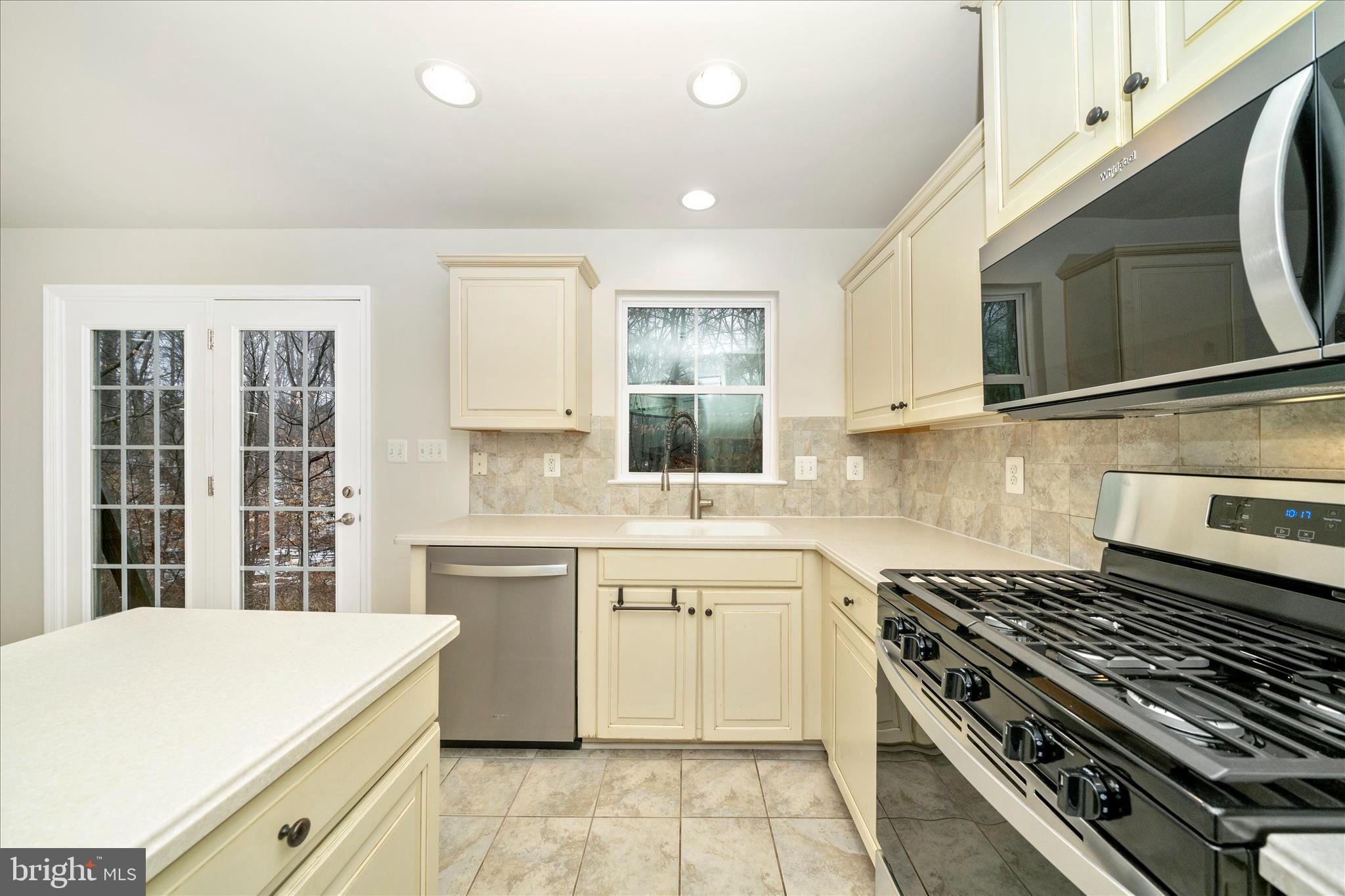 7014 Linden Avenue Elkridge, MD 21075 - Photo 18 of 42 a kitchen with a stove and a sink