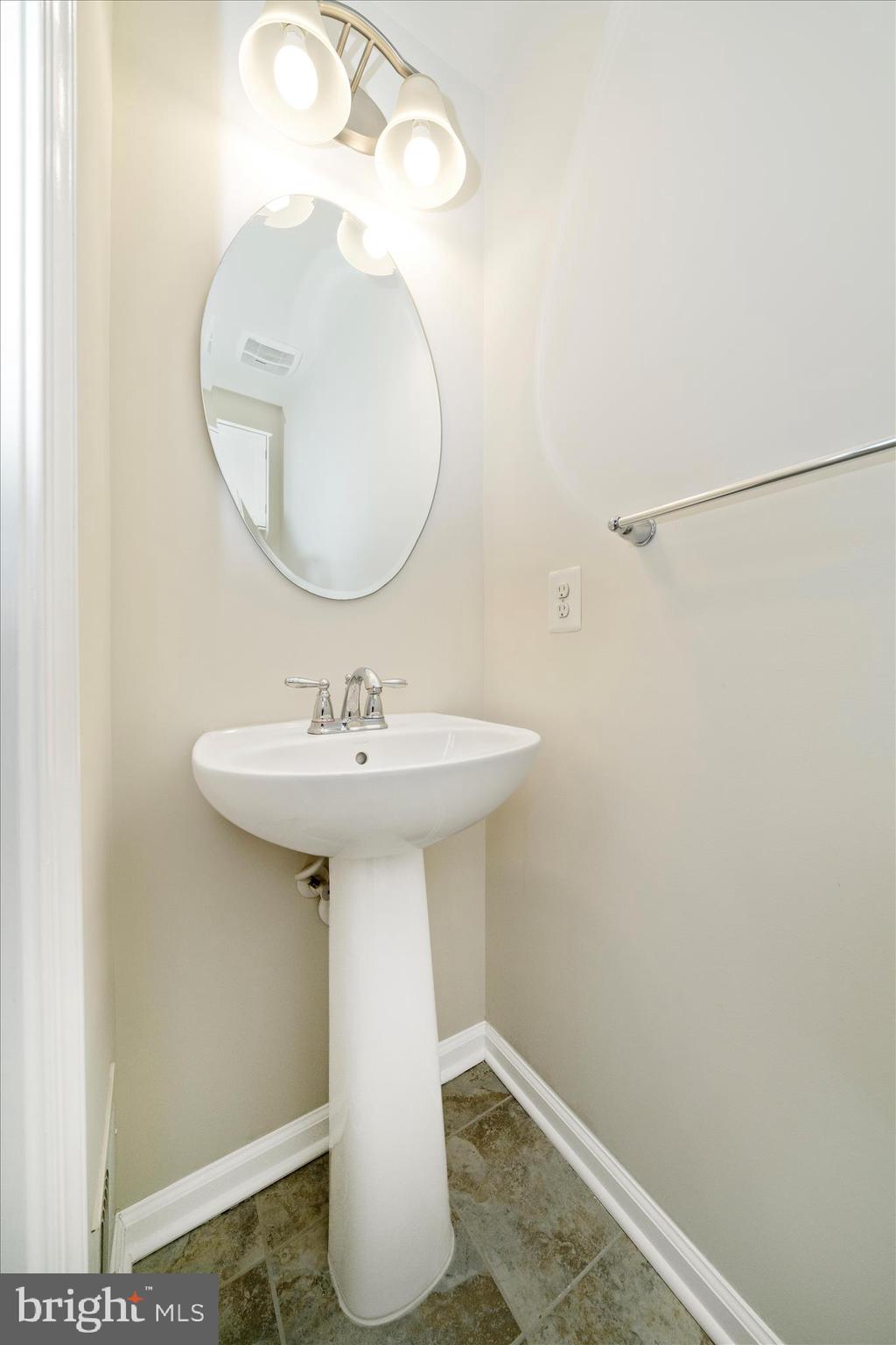 7014 Linden Avenue Elkridge, MD 21075 - Photo 21 of 42 a bathroom with a sink and a mirror