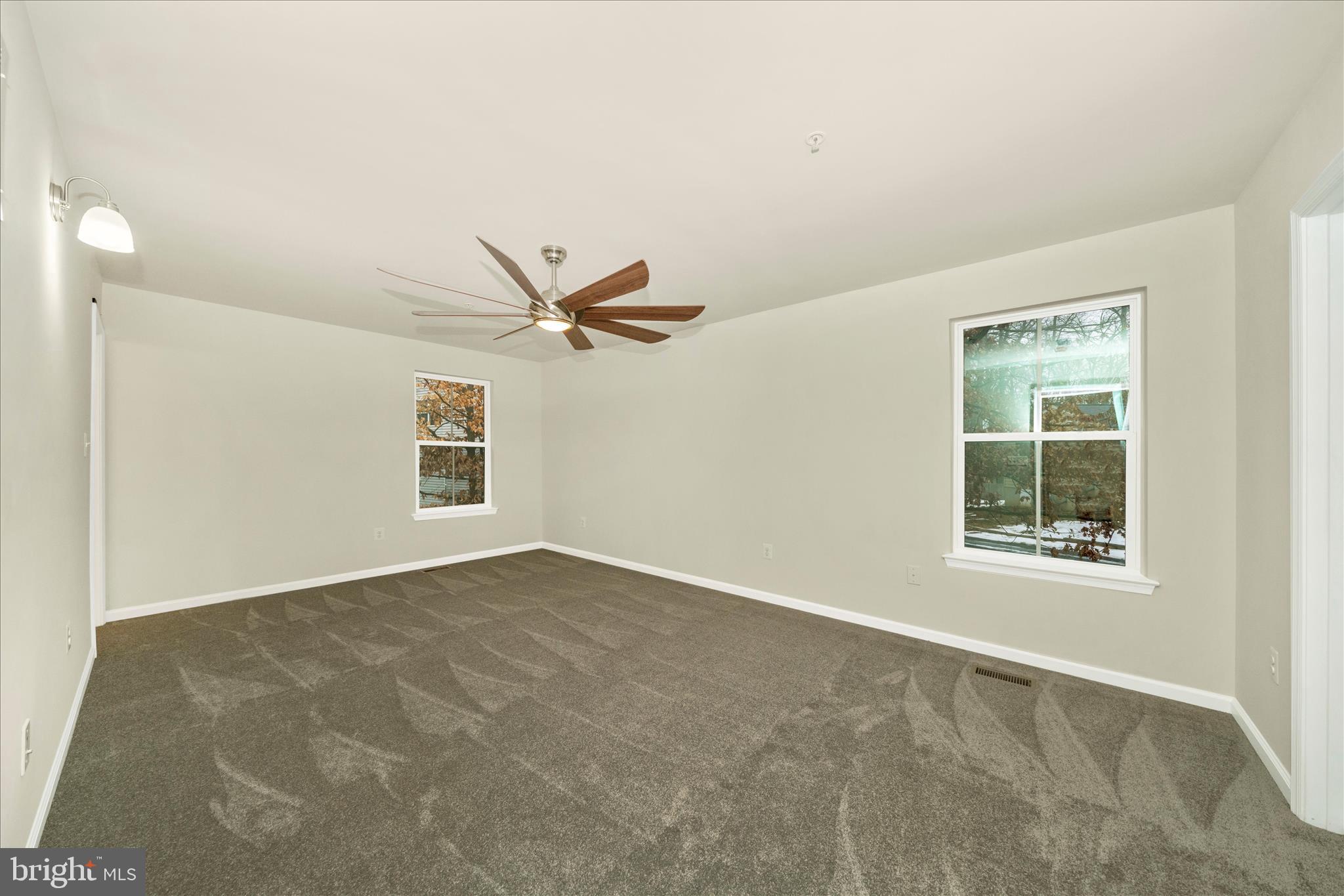7014 Linden Avenue Elkridge, MD 21075 - Photo 23 of 42 an empty room with a window and a ceiling fan