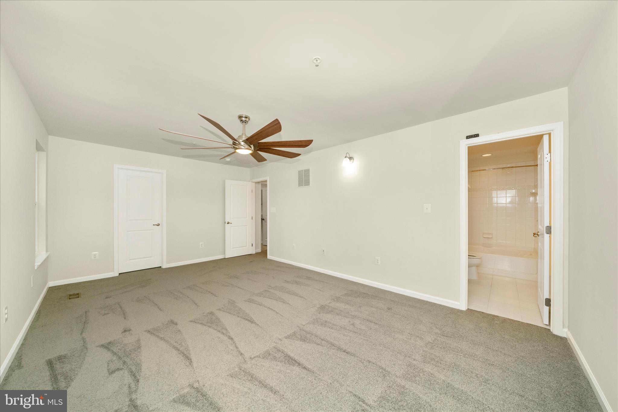 7014 Linden Avenue Elkridge, MD 21075 - Photo 24 of 42 an empty room with closet and windows