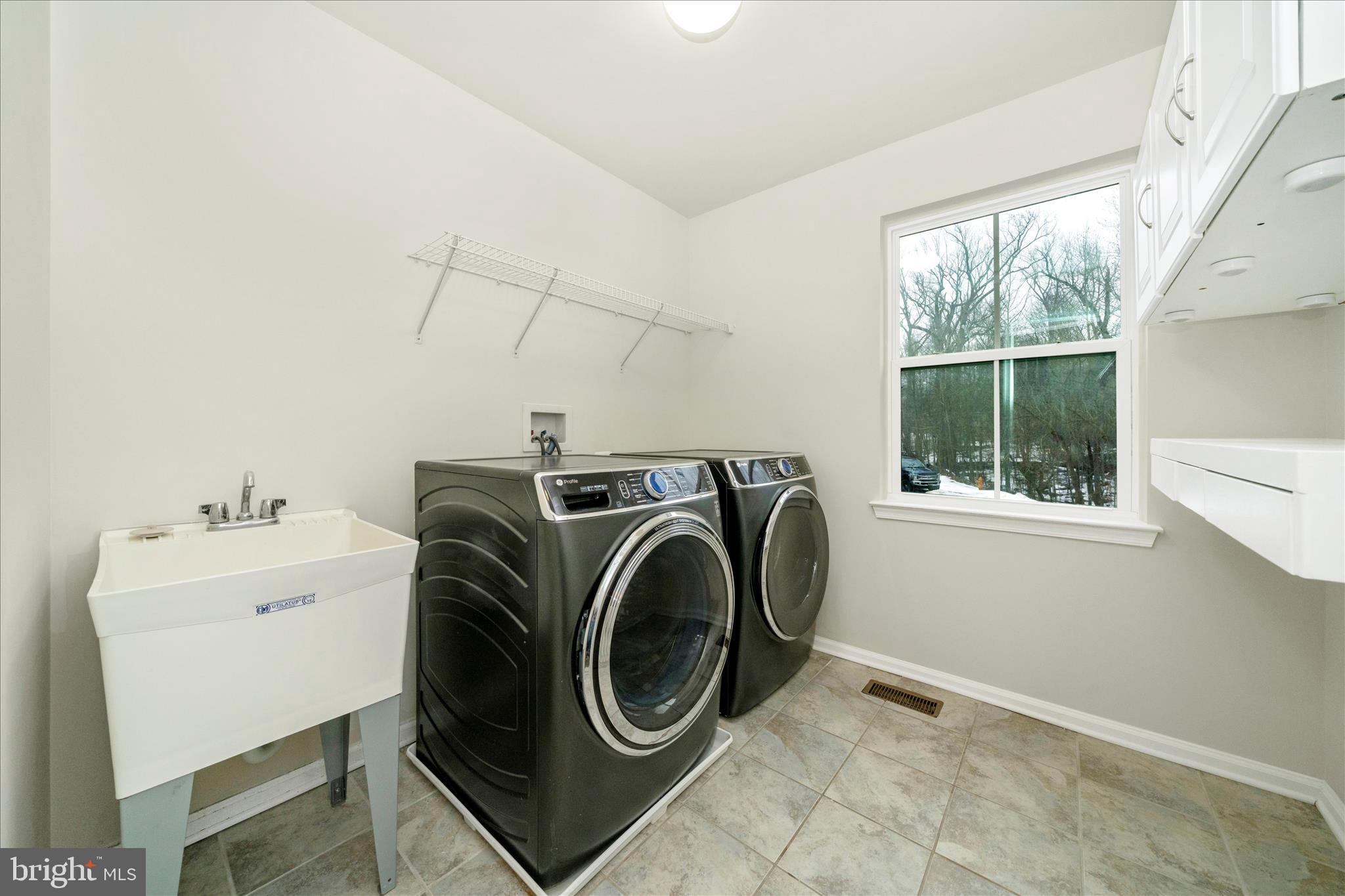 7014 Linden Avenue Elkridge, MD 21075 - Photo 27 of 42 a utility room with dryer and washer