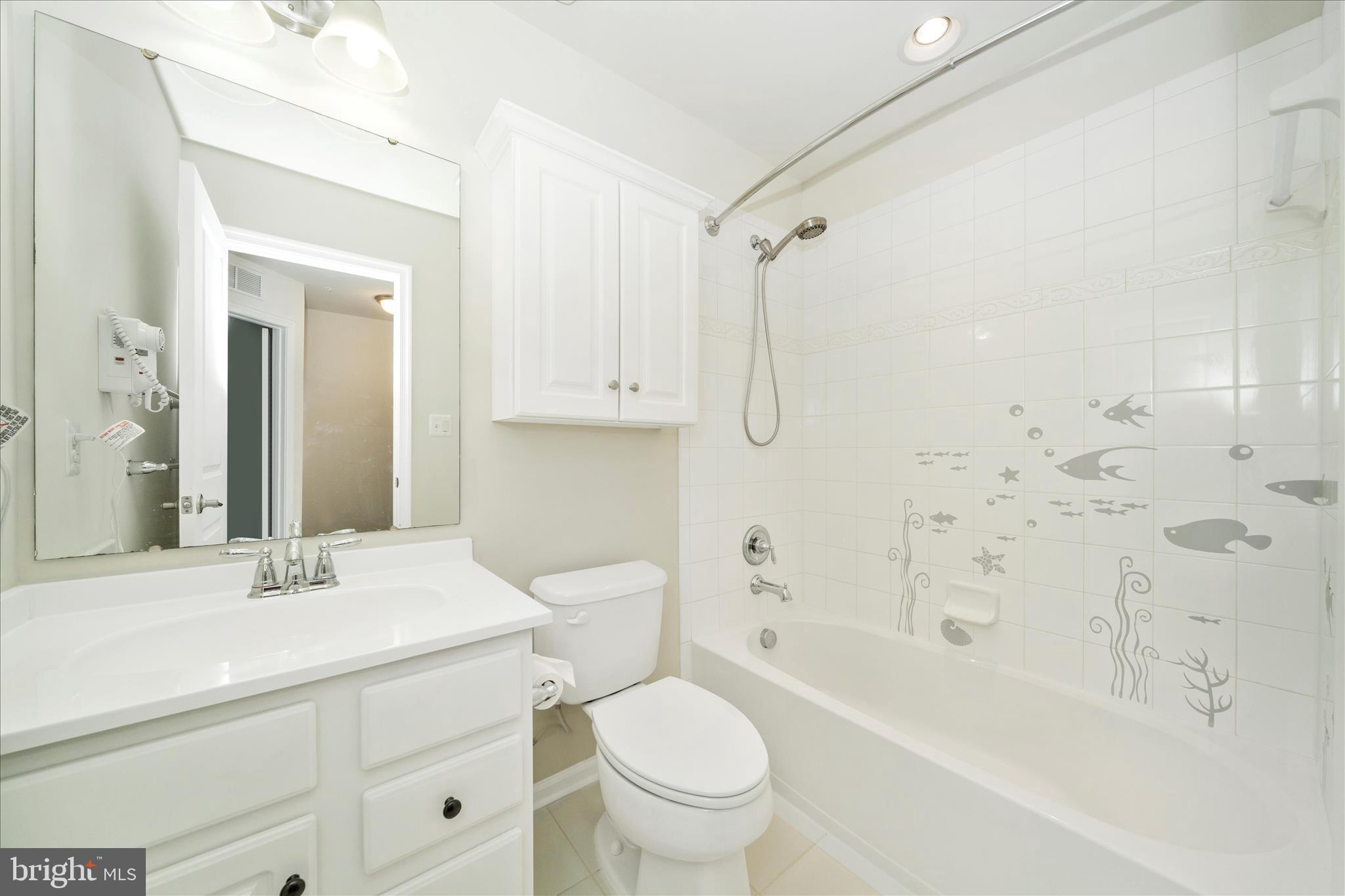 7014 Linden Avenue Elkridge, MD 21075 - Photo 28 of 42 a bathroom with a sink toilet and shower