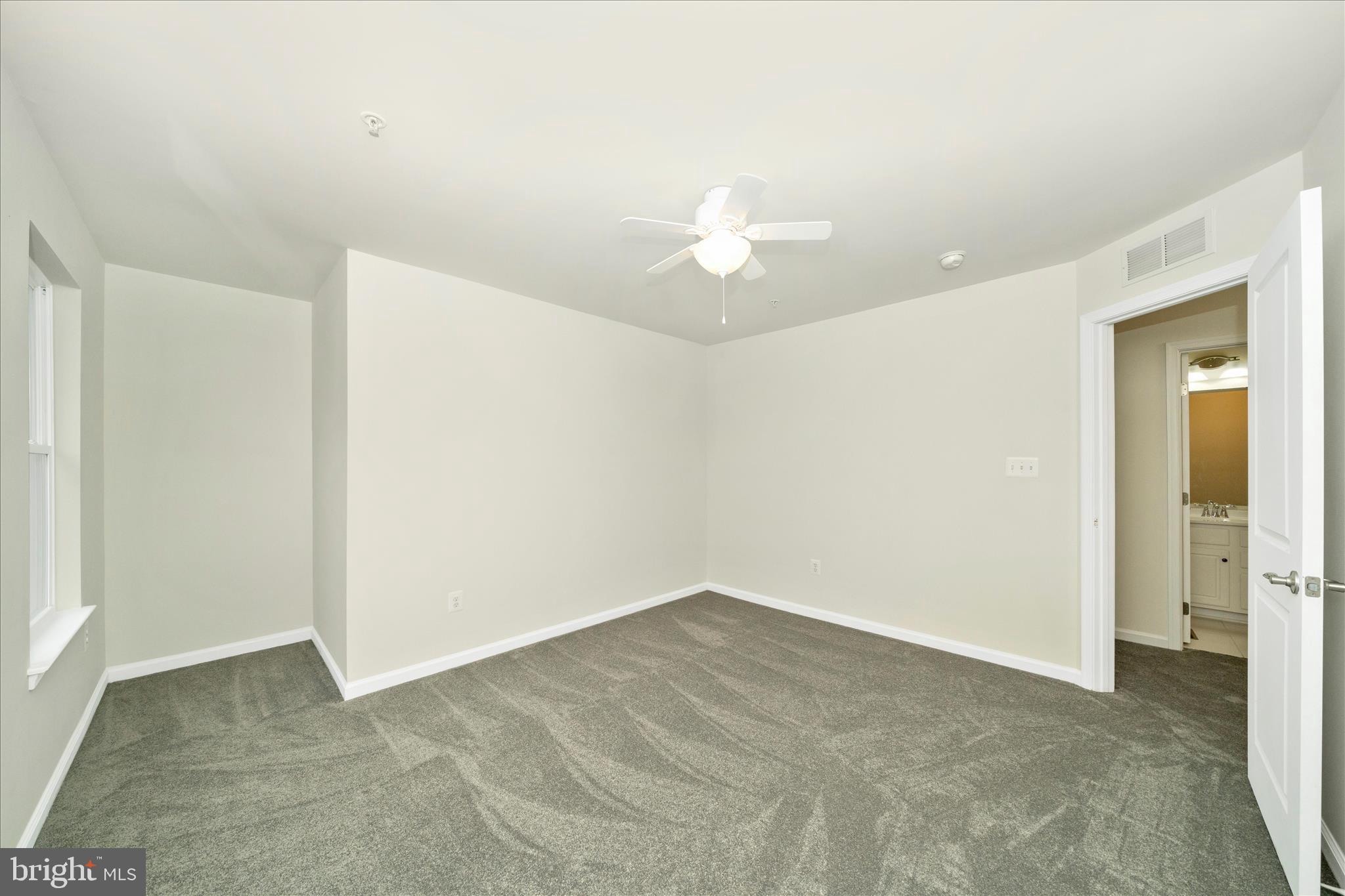 7014 Linden Avenue Elkridge, MD 21075 - Photo 30 of 42 a view of a big room with closet and chandelier fan