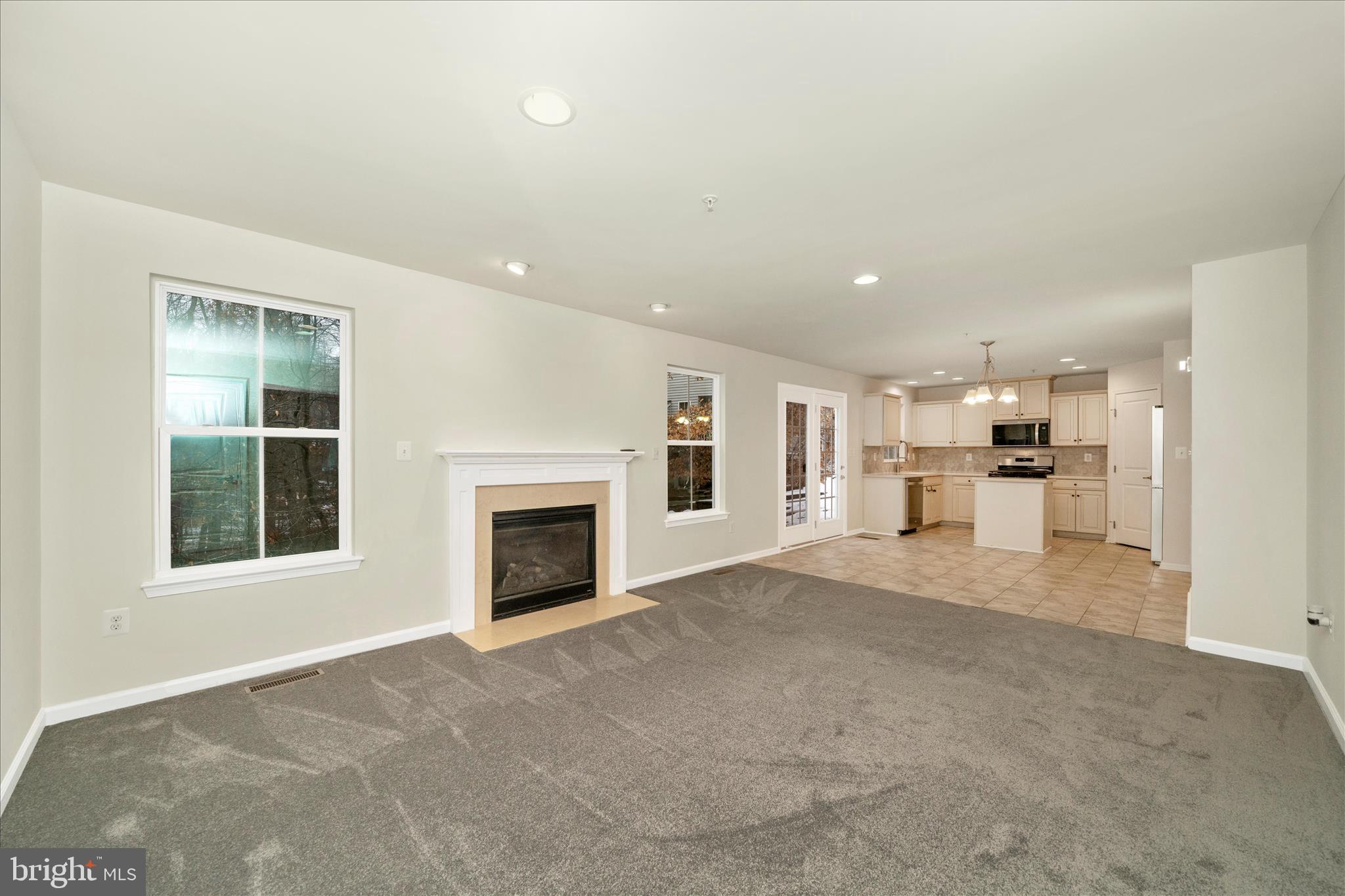 7014 Linden Avenue Elkridge, MD 21075 - Photo 9 of 42 a view of a kitchen with a sink and a fireplace